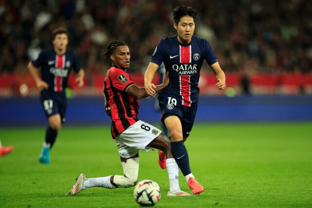 Nice's Hicham Boudaoui and Paris Saint-Germain's Lee Kang-in fight for the ball during the