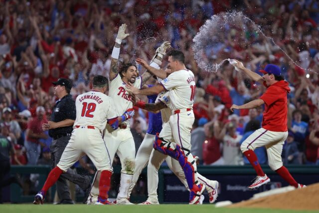 Nick Castellanos (center) celebrates with team-mates after driving in the winning run in t