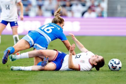 Olivia Moultrie of United States and Hildur Antonsdottir of Iceland battle for the ball in