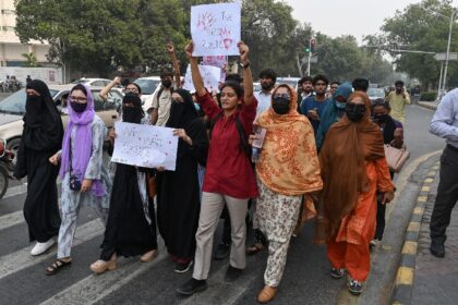 Pakistani students holding placards shout slogans this week at a march protesting the alle