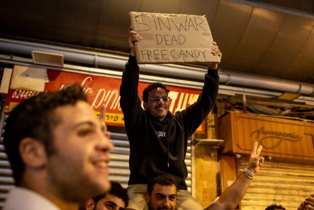 People in Jerusalem celebrate after the Israeli military confirmed the death of Hamas lead