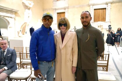 Pharrell Williams (L) and Formula One driver Lewis Hamilton (R), shown here with Anna Wint