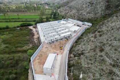 The processing centres are surrounded by high walls and security cameras