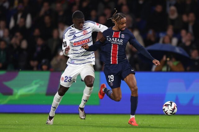 PSG's Bradley Barcola tries to get away from Strasbourg's Mamadou Sarr during Saturday's L