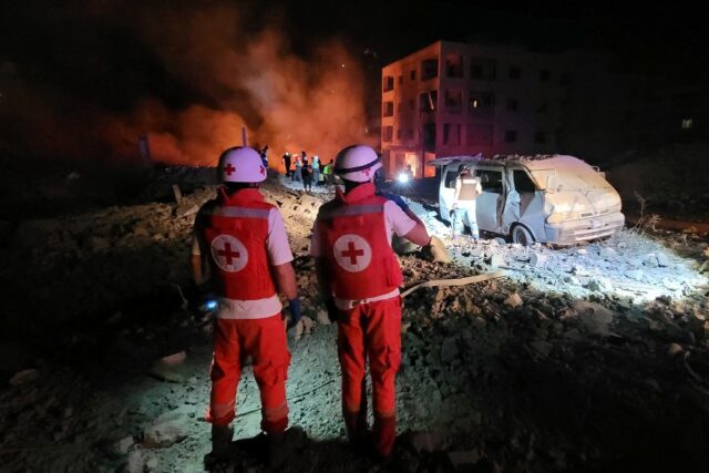 Responders arrive at the site of an Israeli airstrike in Toul, southern Lebanon