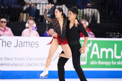 Riku Miura and Ryuichi Kihara of Japan perform their free skate on the way to pairs gold a