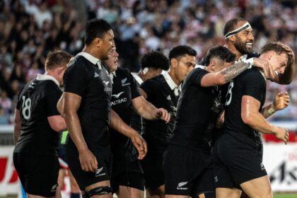 Ruben Love takes his teammates' congratulations after scoring one of his two tries on his