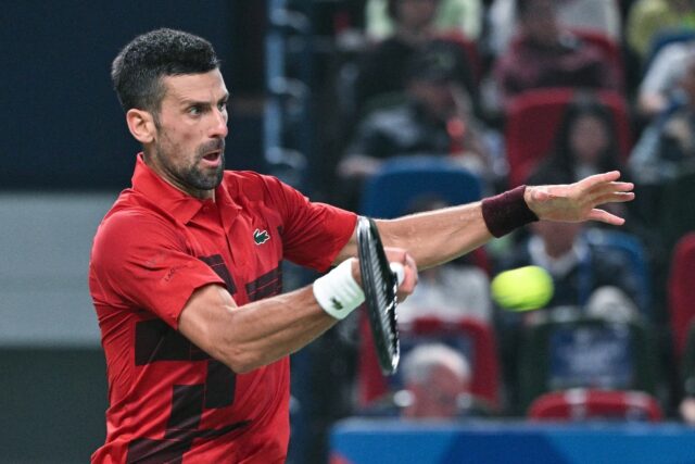 Serbia’s Novak Djokovic hits a return to Czech Republic’s Jakub Mensik during their me