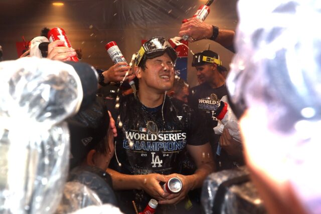 Shohei Ohtani celebrates with team-mates after the Los Angeles Dodgers World Series victor