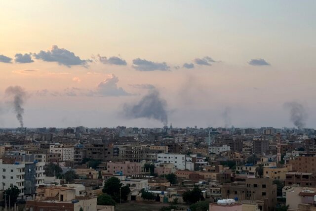 Smoke billows during air strikes in central Khartoum as the Sudanese Armed Forces attack p