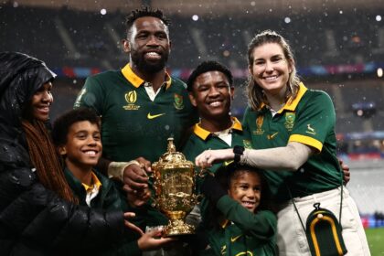 South Africa and captain Siya Kolisi (3rd L) and his wife Rachel Kolisi (R) pose for a pho