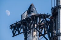 In a first, SpaceX ‘catches’ megarocket booster after test flight