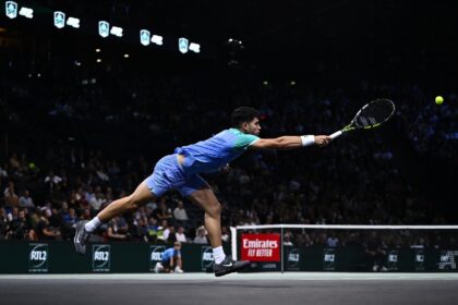 Stunned: Carlos Alcaraz plays a forehand return to France's Ugo Humbert