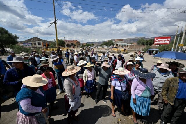 Supporters of former Bolivian President Evo Morales block a road linking Cochabamba with L