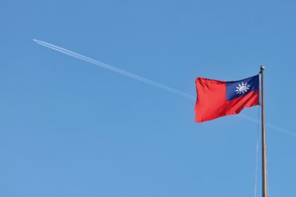 A Taiwan flag flies over the capital, Taipei, in October 2024. The self-ruled island is cl