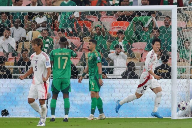 On target: Japan forward Daichi Kamada celebrates after scoring his team's first goal agai