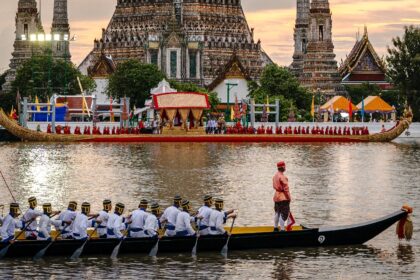 Thousands of well-wishers lined Bangkok's Chao Phraya river Sunday to watch King Maha Vaji