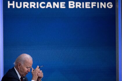 US President Joe Biden listens during a briefing about Hurricane Milton in the Eisenhower