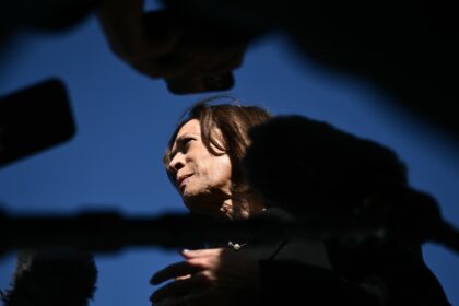 US Vice President and Democratic presidential nominee Kamala Harris talks to reporters bef