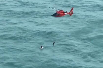 A video grab taken from footage released by the US Coast Guard shows a helicopter crew res