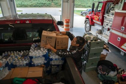 A volunteer unloads relief supplies in North Carolina on October 3, 2024, after the passag