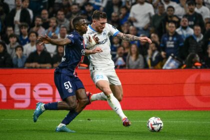 Willian Pacho challenges Marseille forward Pierre-Emile Hojbjerg during PSG's 3-0 win last