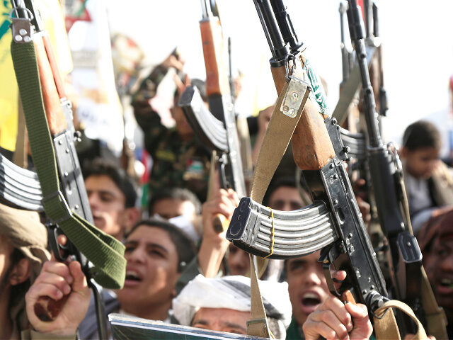 SANA'A, YEMEN - NOVEMBER 1: Yemen's Houthi followers brandish rifles and chant slogans as