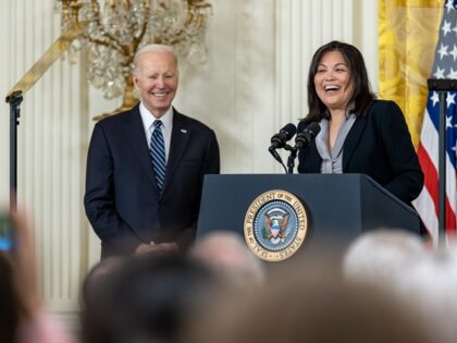 President Joe Biden looks on as Julie Su delivers remarks on her nomination as Secretary o