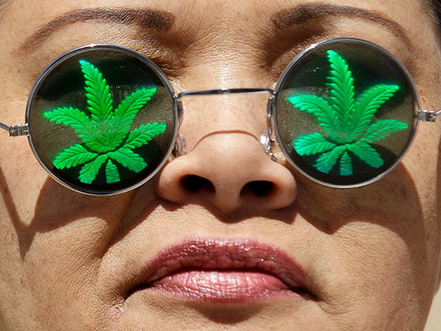 Medical marijuana supporter Lisa Marie Hopwood poses for photographs while wearing marijua