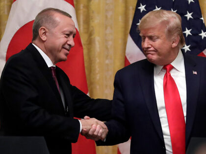 In this Nov. 13, 2019, file photo, President Donald Trump shakes hands with Turkish Presid