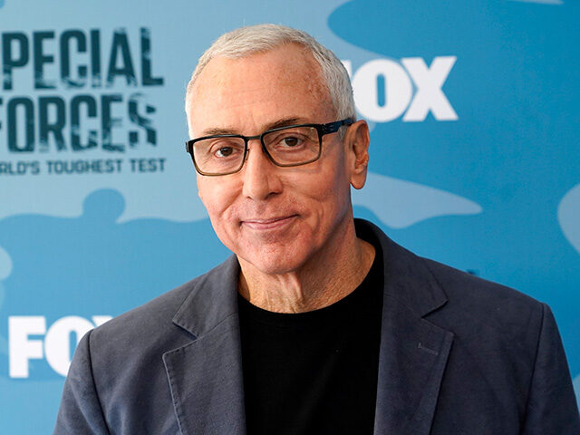 Dr. Drew Pinsky poses at a red carpet event for the reality series "Special Forces: World'