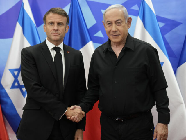 Israeli Prime Minister Benjamin Netanyahu, right, welcomes French President Emmanuel Macro