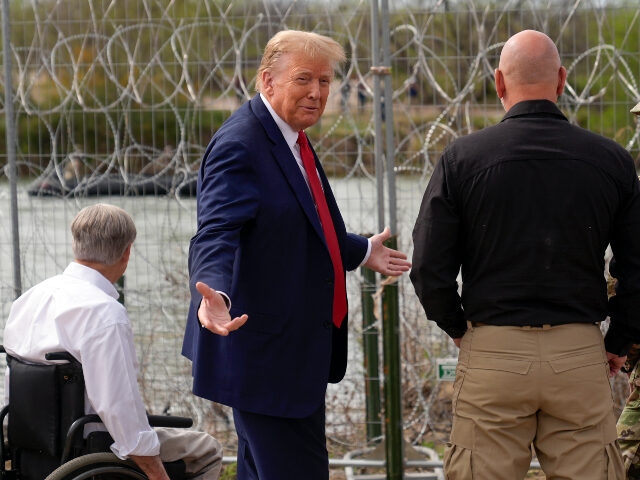 Republican presidential candidate former President Donald Trump gestures near the bank of