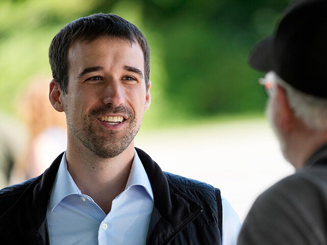 State Rep. Austin Theriault, R-Fort Kent, speaks with a voter, Tuesday, June 11, 2024, in