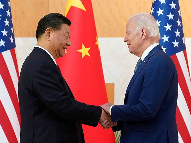 U.S. President Joe Biden, right, and Chinese President Xi Jinping shake hands before their