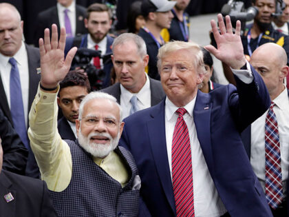 India Prime Minister Narendra Modi and then President Donald Trump walk the perimeter of t