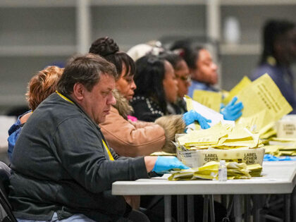 Election workers process mail-in ballots for the general election at the Philadelphia Elec