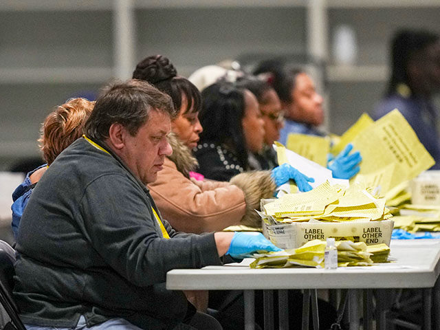 Election workers process mail-in ballots for the general election at the Philadelphia Elec