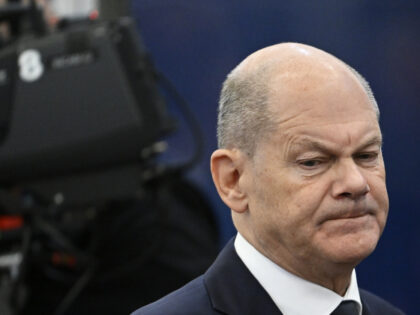 Germany's Chancellor Olaf Scholz arrives for a plenary session during an EU Summit at