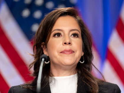 Rep. Elise Stefanik, R-N.Y., is seated before President-elect Donald Trump arrives at a me