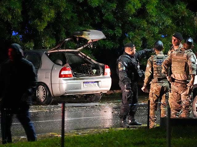 Police inspect a vehicle outside the Supreme Court in Brasília, Brazil, following an expl