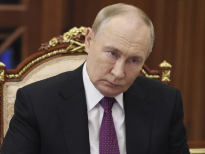 Russian President Vladimir Putin listens to the leader of the Liberal-Democratic Party of