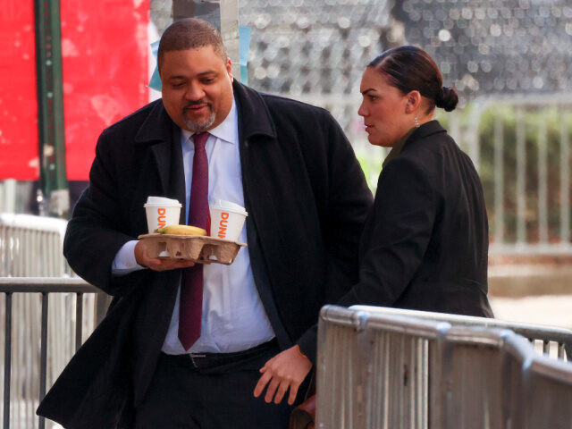 Manhattan district attorney Alvin Bragg, left, arrives at Manhattan criminal court, Tuesda