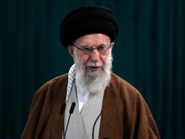 FILE - Iranian Supreme Leader Ayatollah Ali Khamenei speaks with media members after he vo