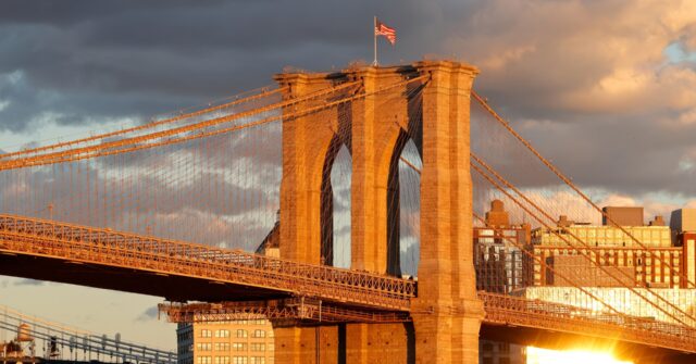 NextImg:PHOTOS: NYPD Cops Rescue Man Dangling from Brooklyn Bridge