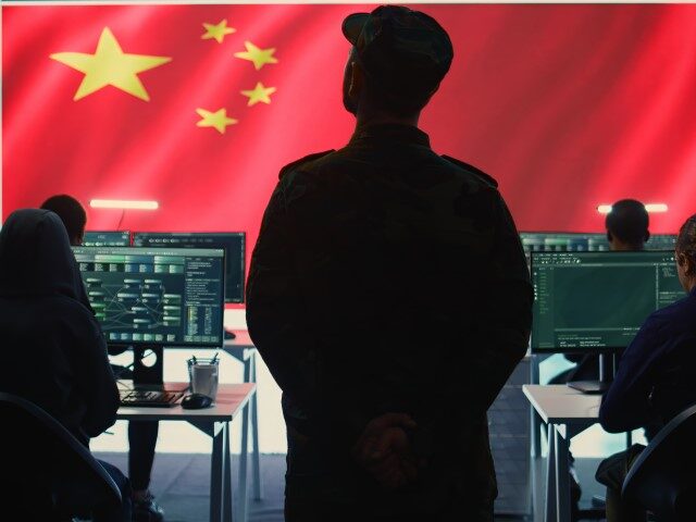 Chinese military personnel in a high tech government hacking room work on stealing state s