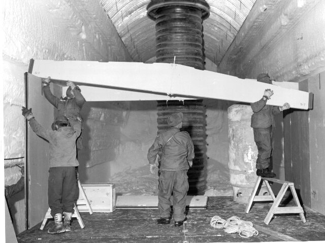 Men place a truss to the permanent camp at Century Camp, Greenland. (Pictorial Parade/Arch