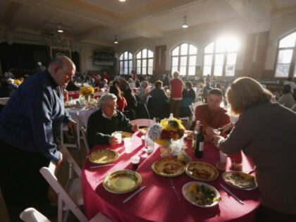 NEW YORK, NY - NOVEMBER 22: Residents gather for a free Thanksgiving dinner at St. Francis