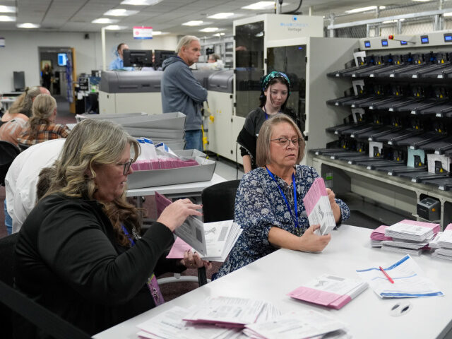 Election workers count ballots at the Washoe County Registrar of Voters Office, Tuesday, N