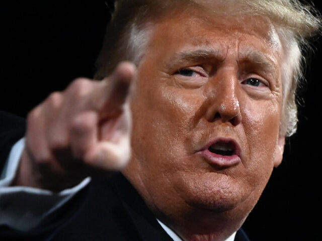 US President Donald Trump points at the end of a rally to support Republican Senate candid